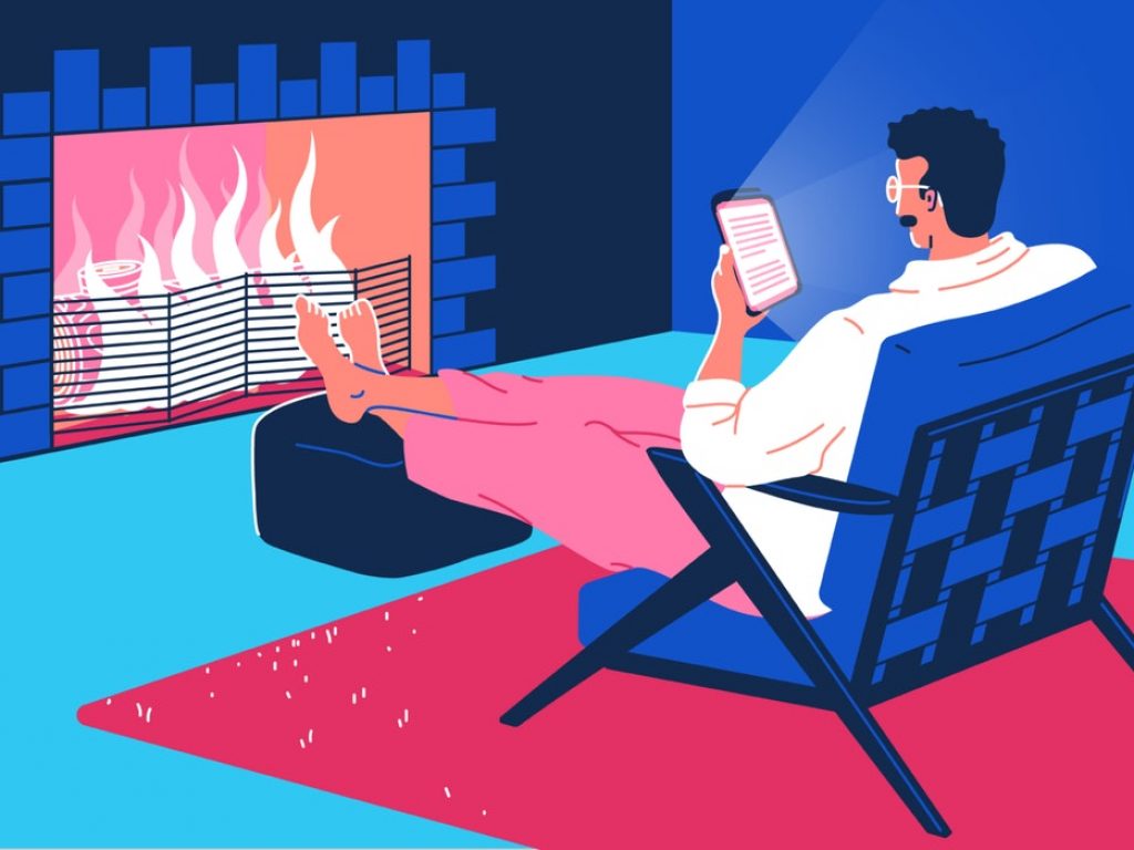 mixkit-man-sitting-in-front-of-a-fire-reading-from-a-66-original-large.jpg